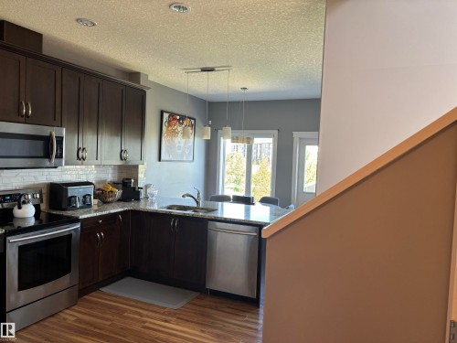 6694 Cardinal Road, Edmonton, AB - Indoor Photo Showing Kitchen With Double Sink