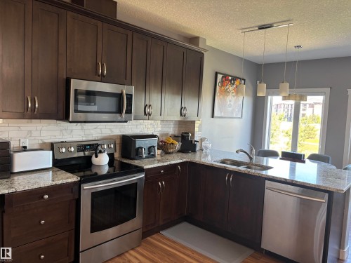 6694 Cardinal Road, Edmonton, AB - Indoor Photo Showing Kitchen With Double Sink