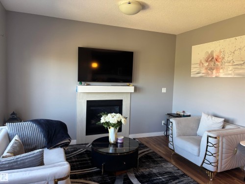 6694 Cardinal Road, Edmonton, AB - Indoor Photo Showing Living Room With Fireplace