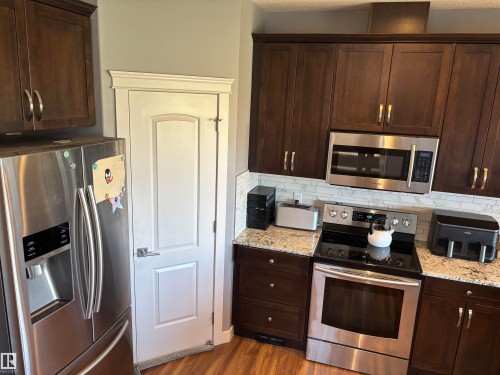 6694 Cardinal Road, Edmonton, AB - Indoor Photo Showing Kitchen With Stainless Steel Kitchen