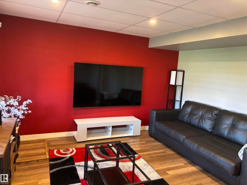 6694 Cardinal Road, Edmonton, AB - Indoor Photo Showing Living Room With Fireplace