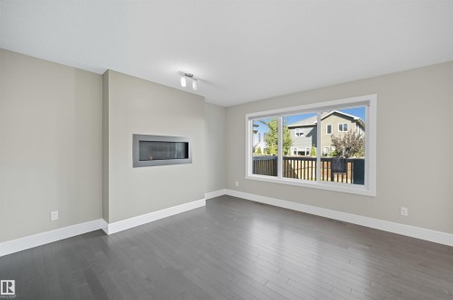 7122 Armour Link Link, Edmonton, AB - Indoor Photo Showing Living Room With Fireplace