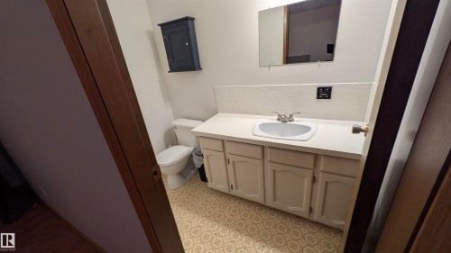 Bathroom featuring vanity and backsplash - 74038 Birch Avenue, Widewater, AB - Indoor Photo Showing Bathroom