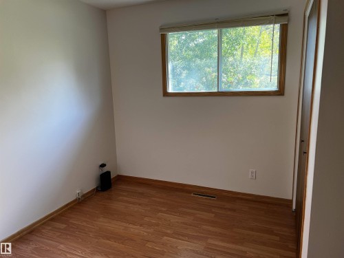 Unfurnished room with wood finished floors and baseboards - 74038 Birch Avenue, Widewater, AB - Indoor Photo Showing Other Room