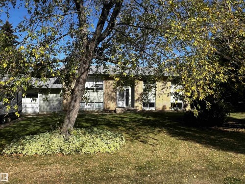 View of property hidden behind natural elements with a front lawn - 74038 Birch Avenue, Widewater, AB - Outdoor