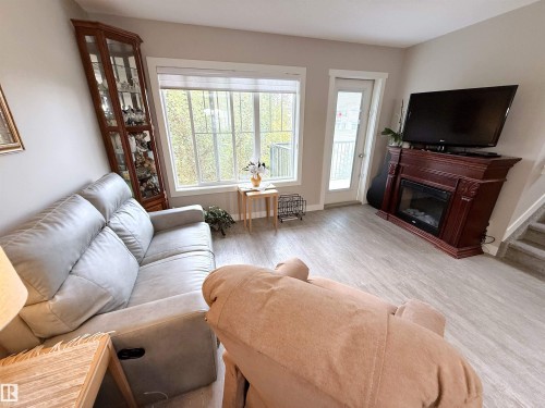 41 50 Mclaughlin Drive, Spruce Grove, AB - Indoor Photo Showing Living Room With Fireplace