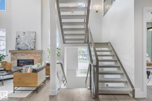 5604 Cautley Cove Cove, Edmonton, AB - Indoor Photo Showing Other Room With Fireplace
