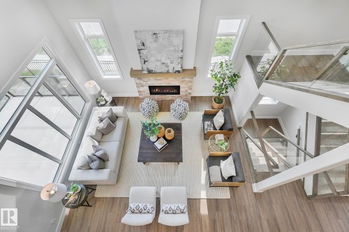 5604 Cautley Cove Cove, Edmonton, AB - Indoor Photo Showing Other Room With Fireplace