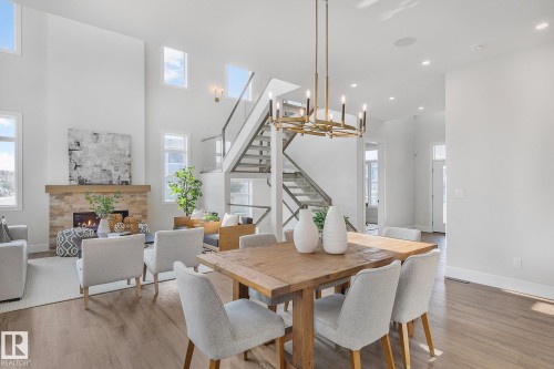 5604 Cautley Cove Cove, Edmonton, AB - Indoor Photo Showing Dining Room With Fireplace