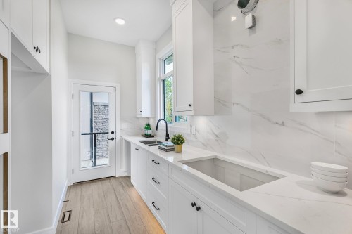 5604 Cautley Cove Cove, Edmonton, AB - Indoor Photo Showing Kitchen With Double Sink