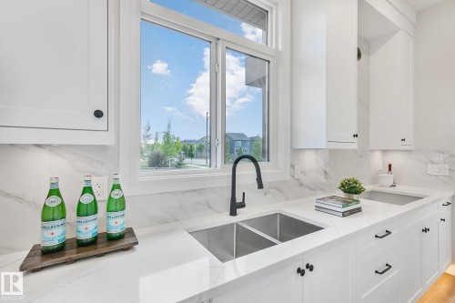 5604 Cautley Cove Cove, Edmonton, AB - Indoor Photo Showing Kitchen With Double Sink