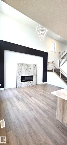 1135 Gyrfalcon Crescent, Edmonton, AB - Indoor With Fireplace