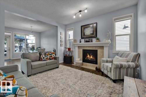 2585 Cole Crescent, Edmonton, AB - Indoor Photo Showing Living Room With Fireplace