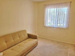 Sitting room featuring carpet flooring and baseboards - 