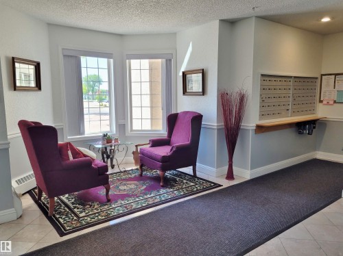 Community lobby with a textured ceiling - 404 13450 114 Avenue, Edmonton, AB - Indoor