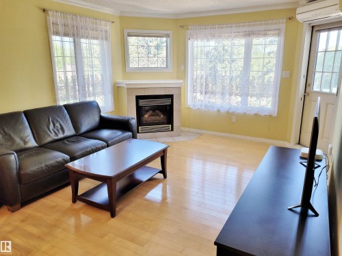 404 13450 114 Avenue, Edmonton, AB - Indoor Photo Showing Living Room With Fireplace