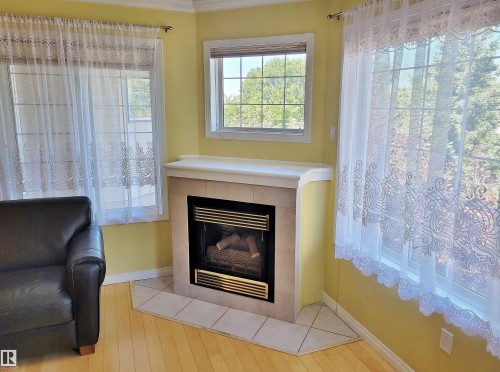 404 13450 114 Avenue, Edmonton, AB - Indoor Photo Showing Living Room With Fireplace