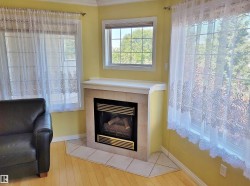 Detailed view of a fireplace, wood finished floors - 