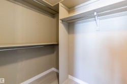 Walk in closet featuring light wood-style floors - 