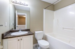 Full bath featuring vanity, tub / shower combination, and a textured ceiling - 