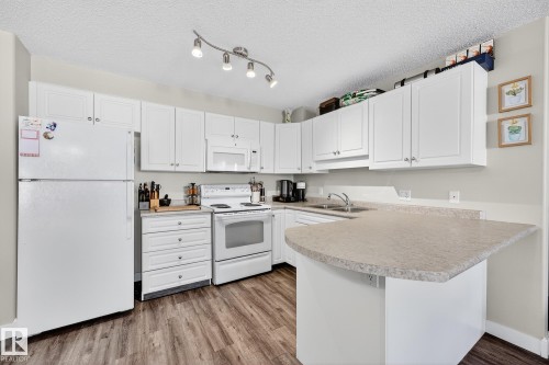 303 13625 34 Street, Edmonton, AB - Indoor Photo Showing Kitchen With Double Sink
