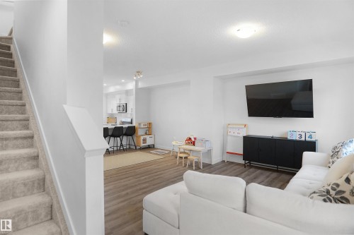 19 903 Crystallina Nera Way, Edmonton, AB - Indoor Photo Showing Living Room