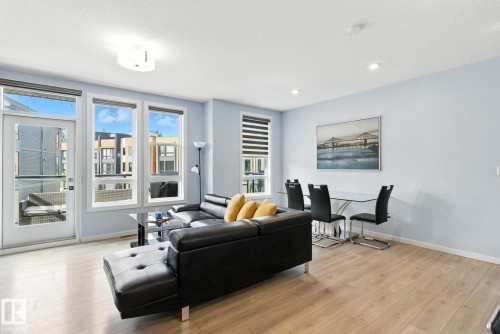 105 1304 Rutherford Rd, Edmonton, AB - Indoor Photo Showing Living Room