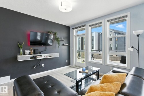 105 1304 Rutherford Rd, Edmonton, AB - Indoor Photo Showing Living Room