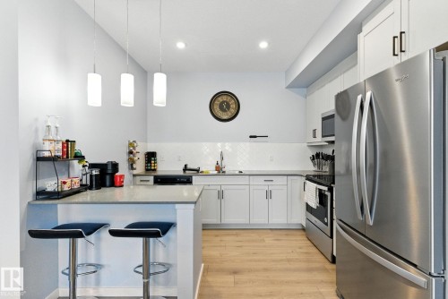 105 1304 Rutherford Rd, Edmonton, AB - Indoor Photo Showing Kitchen With Stainless Steel Kitchen With Upgraded Kitchen