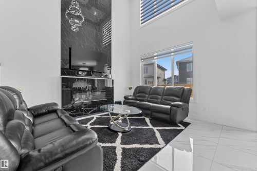 5814 Peltier Close, Beaumont, AB - Indoor Photo Showing Living Room With Fireplace