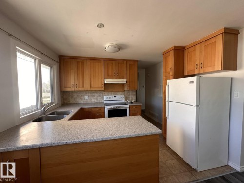7504 77 Avenue, Edmonton, AB - Indoor Photo Showing Kitchen With Double Sink