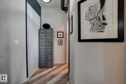 Corridor featuring wood finished floors and baseboards - 
