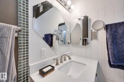 Bathroom with tile walls and vanity - 