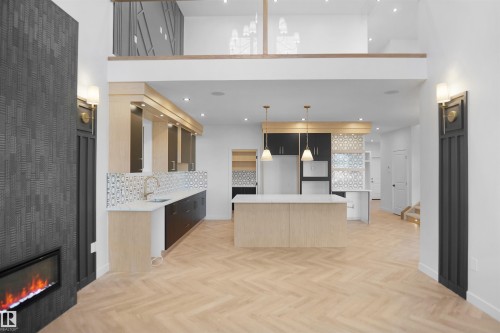 27 Trill Point, Spruce Grove, AB - Indoor Photo Showing Kitchen With Fireplace