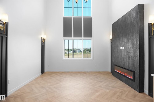 27 Trill Point, Spruce Grove, AB - Indoor Photo Showing Other Room With Fireplace