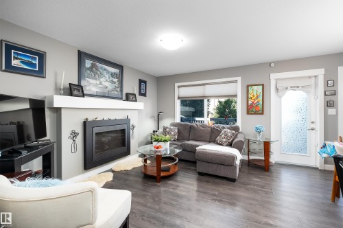 136 Reed Place, Leduc, AB - Indoor Photo Showing Living Room With Fireplace
