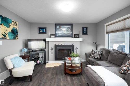 136 Reed Place, Leduc, AB - Indoor Photo Showing Living Room With Fireplace