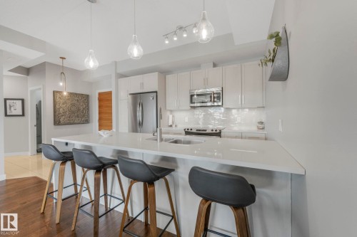 409 625 Leger Way Nw, Edmonton, AB - Indoor Photo Showing Kitchen With Upgraded Kitchen