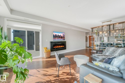 409 625 Leger Way Nw, Edmonton, AB - Indoor Photo Showing Living Room With Fireplace