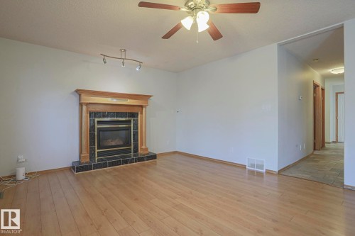 16120 57A Street Nw, Edmonton, AB - Indoor Photo Showing Living Room With Fireplace