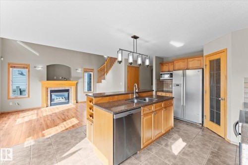 121 Castle Drive, Edmonton, AB - Indoor Photo Showing Kitchen With Fireplace With Double Sink