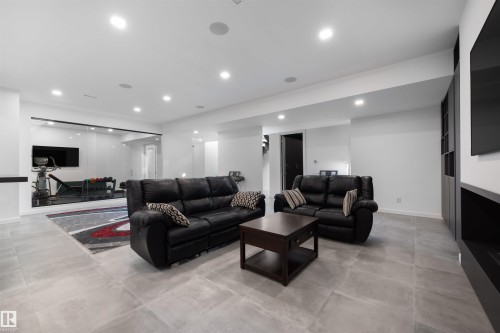 17 Windermere Drive, Edmonton, AB - Indoor Photo Showing Living Room With Fireplace