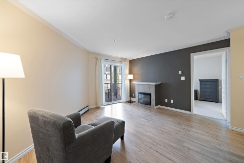 308 9938 104 Street, Edmonton, AB - Indoor Photo Showing Living Room With Fireplace