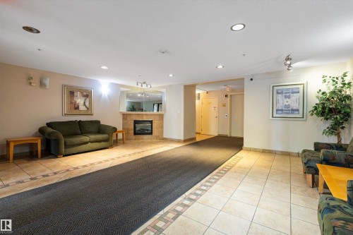 308 9938 104 Street, Edmonton, AB - Indoor With Fireplace