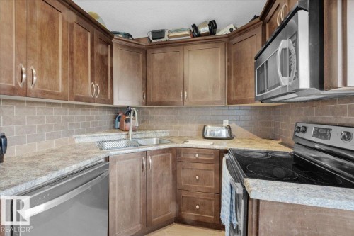 4 9650 82 Avenue, Edmonton, AB - Indoor Photo Showing Kitchen With Double Sink