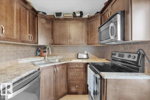 4 9650 82 Avenue, Edmonton, AB - Indoor Photo Showing Kitchen With Double Sink