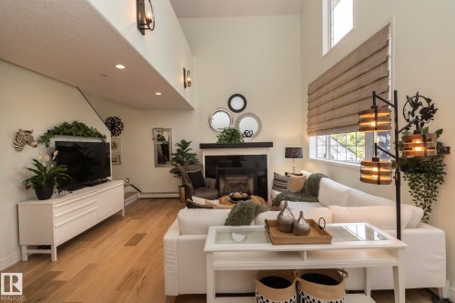 304 14 Mission Avenue, St. Albert, AB - Indoor Photo Showing Living Room With Fireplace