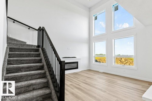 5018 53 Ave, Calmar, AB - Indoor Photo Showing Other Room With Fireplace