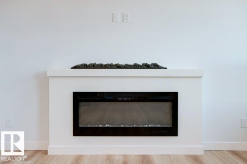5018 53 Ave, Calmar, AB - Indoor Photo Showing Living Room With Fireplace