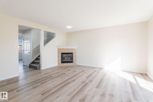 2912 31 Street, Edmonton, AB - Indoor Photo Showing Other Room With Fireplace